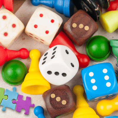 Dice, pawns, and puzzle pieces
