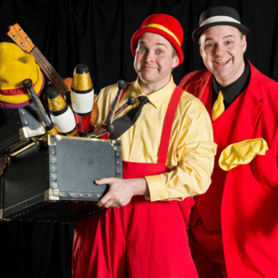 Miller and Mike holding a box of colorful objects