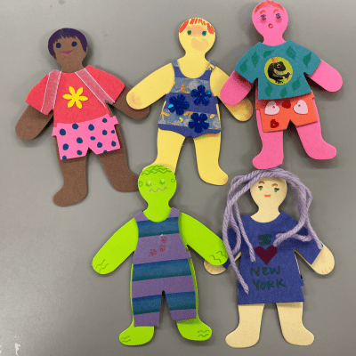 Five paper dolls with different outfits